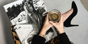 Coffee glass over magazine