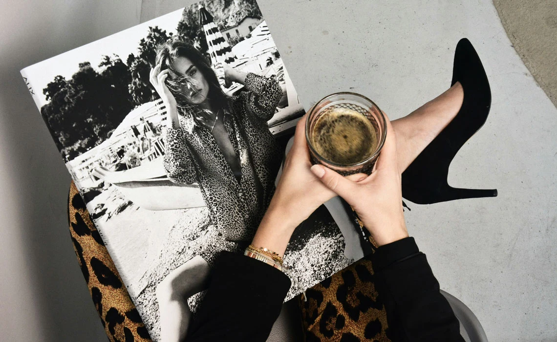 Coffee glass over magazine