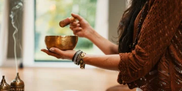 Hand holding tea cup