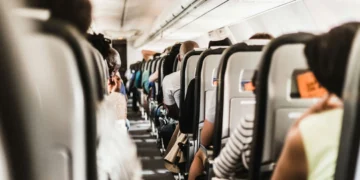 passengers seated inside airplane