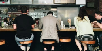people sitting at bar