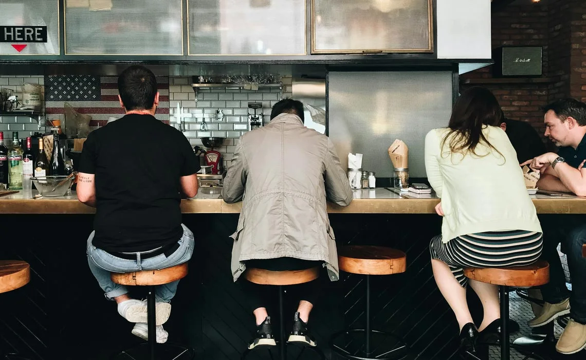 people sitting at bar