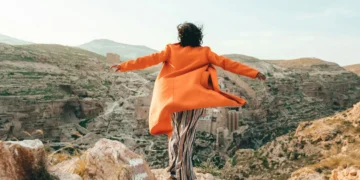 person enjoying cliff view