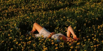 person lying in flowers