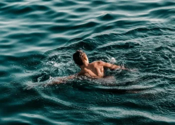person swimming in ocean