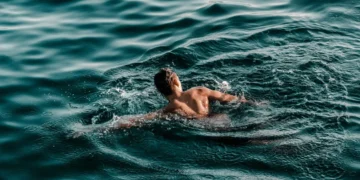 person swimming in ocean
