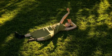 Woman lying on grass
