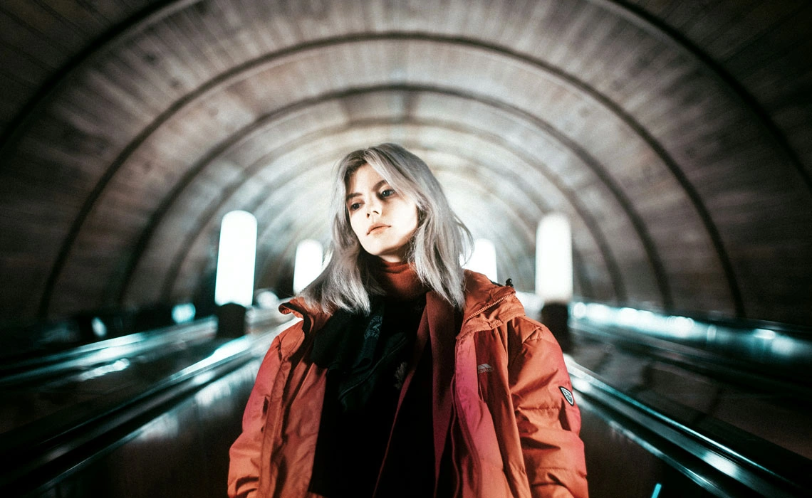 woman standing tunnel